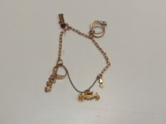 9ct yellow gold charm bracelet with 3 charms appro