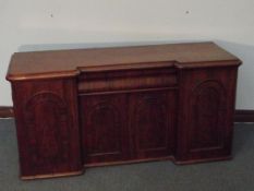 Victorian inverted breakfront mahogany sideboard, freize drawer above a double cabinet flanked by