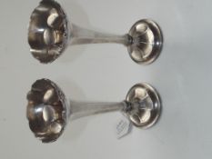 A pair of sterling silver bud vases