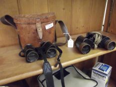Pair of early cased field glasses together with a