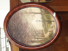 Oil on canvas set in a cameo shaped frame, signed