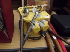 110 volt transformer together with two spanners
