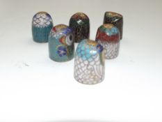 A collection of cloisonné thimbles