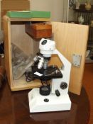 Philip Harris three lens microscope, cased with 50