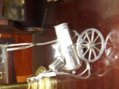 Silver plated brandy warmer in the form of a canno