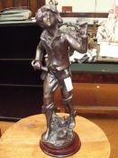 Bronze figure of a grape picker
