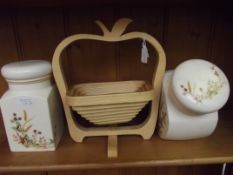 Two storage jars together with a bamboo fruit bask