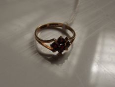 9 ct gold lady's dress ring with red stones