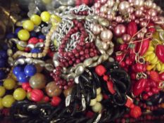 Tin of costume jewellery