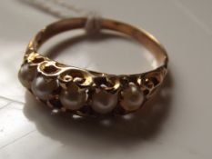 Yellow metal 5 stone pearl ring