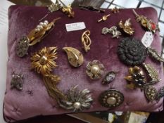 Cushion with pin brooches