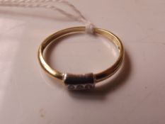 14 carat gold set with three diamonds