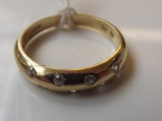14 carat gold ring set with nine diamonds, 3.5 gra