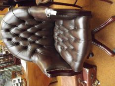 Good quality deep buttoned leather swivel chair