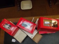 Three boxed Corgi buses