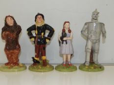 Set of four Royal Doulton figures, Dorothy, Lion,