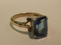 9 carat gold dress ring set with an emerald cut to