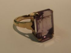 9 carat gold dress ring with large emerald cut gem