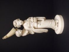 Japanese Meiji period ivory okimono group in the form of a mother bearing an infant on her back