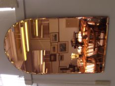 Art deco peach tinted bevel edge wall mirror, the