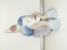A large Lladro bust of a sad clown resting his hea