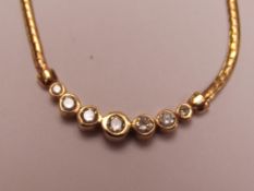 14ct gold necklace set with seven diamonds 0.85ct