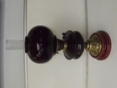 Art nouveau ruby glass oil lamp with brass repouss