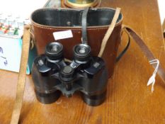 Pair of field glasses in a leather case
