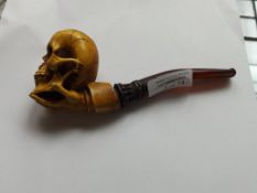 Pipe in the form of a skull