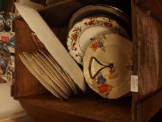 Box of meat plates and a cake stand