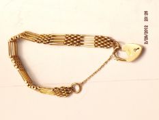 9ct gold bracelet with safety chain and heart lock