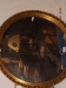 Circular gilt framed mirror