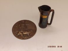 A Great War bronze death penny awarded to Thomas M