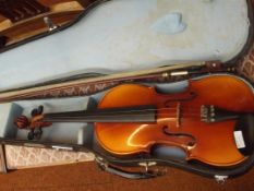 Cased violin with bow