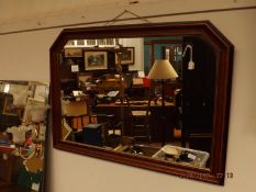 Large wooden framed over mantel mirror