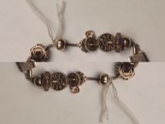 Silver bracelet with charms
