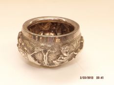 A Raj period Indian silver bowl, chased with vario