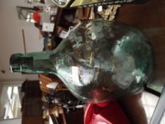 Glass carboy together with a similar example