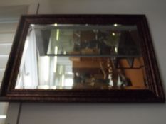 Framed bevelled edge wall mirror