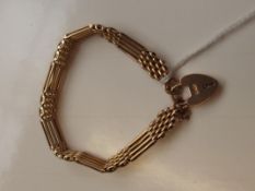 9 carat gold gate bracelet with heart locket and s