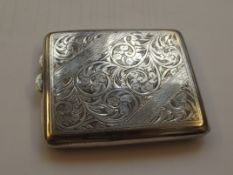 Silver cigarette case, profuse foliate decoration,