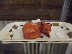 Beswick figure of a recumbent fox together with tw