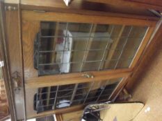 Solid oak cabinet, glazed and leaded doors
