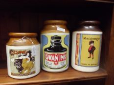 Three stoneware advertising jars