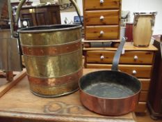 Copper and brass coal bucket together with a rivet