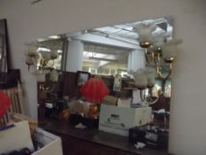 Large illuminating wall mirror, the brass lamp bra