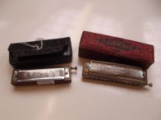 Two cased Hohner Chromonicas
