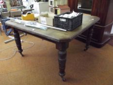 Victorian oak extending dining table on turned sup