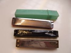 Three vintage harmonicas, to include Hohner Song B