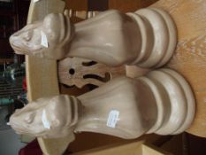 Pair of oversized knight chess pieces